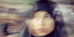 portrait of muslim woman in street