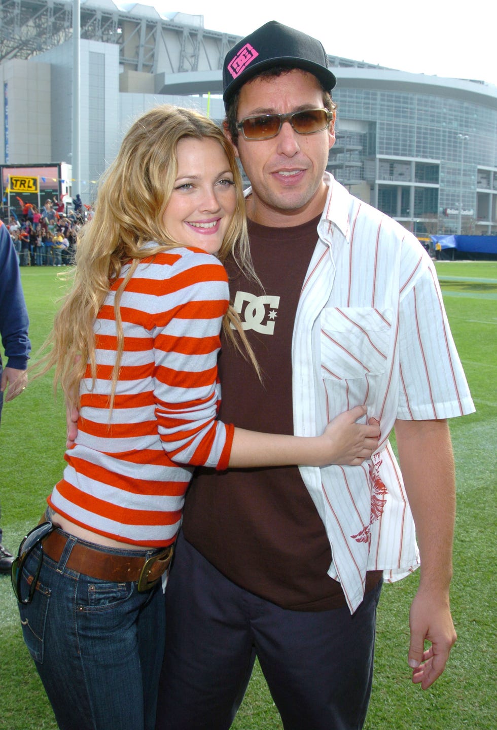drew barrymore and adam sandler during mtvs trl at super bowl xxxviii at reliant stadium in houston, texas, united states photo by kmazurwireimage
