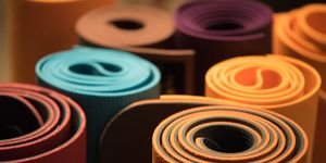 Close-Up Of Multi Colored Rolled Exercise Mats