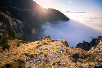 woman trail running in the mountains, salzburg, austria