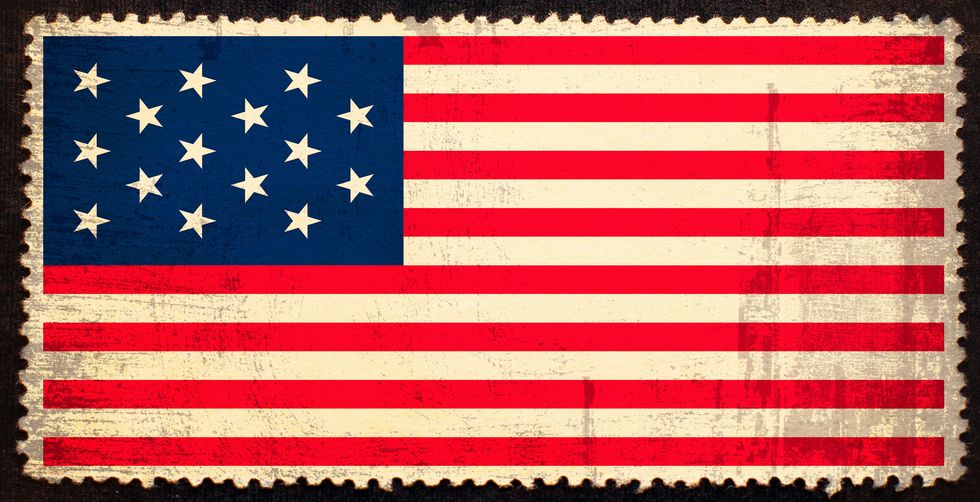 old grunge flag 1795 1818 of the united states of america on the old grunge postage stamp isolated on black background texture of old grungy paper