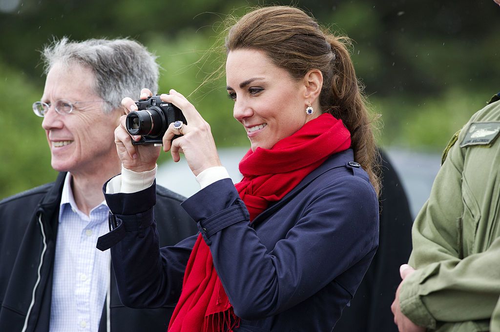 charlottetown, pe   july 04  catherine, duchess of cambridge takes photographs as prince william, duke of cambridge takes part in helicopter manouvres called water birding across dalvay lake on july 4, 2011 in charlottetown, canada the newly married royal couple are on the fifth day of their first joint overseas tour the 12 day visit to north america is taking in some of the more remote areas of the country such as prince edward island, yellowknife and calgary the royal couple started off their tour by joining millions of canadians in taking part in canada day celebrations which mark canadas 144th birthday  photo by arthur edwards   poolgetty images