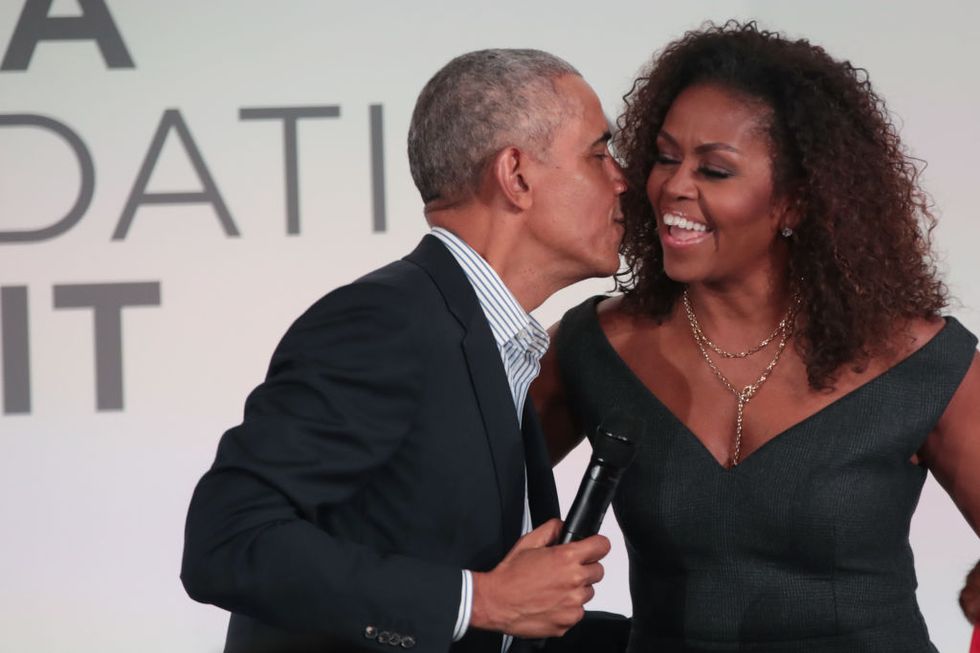 chicago, illinois october 29 former us president barack obama gives his wife michelle a kiss as they close the obama foundation summit together on the campus of the illinois institute of technology on october 29, 2019 in chicago, illinois the summit is an annual event hosted by the obama foundation photo by scott olsongetty images