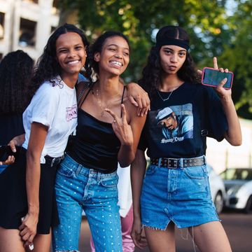 paris, france   june 29  models natalia montero, manuela sancehz, and rocio marconi throw peace signs after the miu miu resort 2020 show on june 29, 2019 in paris, france natalia wears a prada t shirt rocio wears a black headband, black snoop dog t shirt, and denim skirt photo by melodie jenggetty images