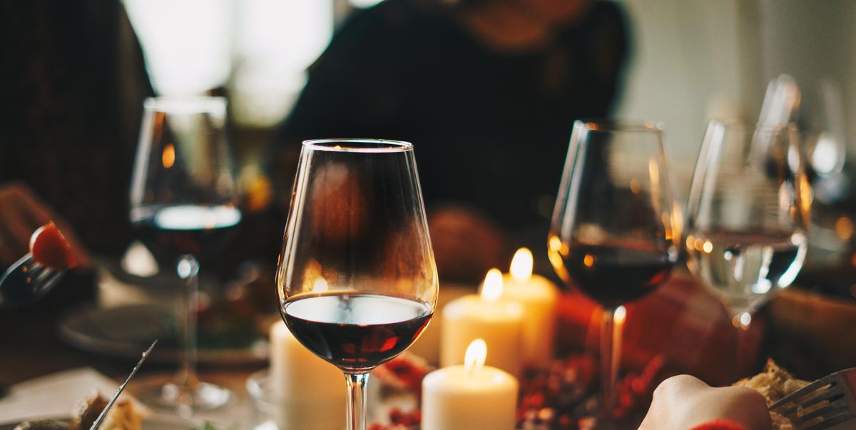 red wine glasses at the decorated dinner table