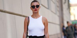 milan, italy   september 20  a guest wears sunglasses, a white tank top, black leather large pants, black shoes, outside the etro show during milan fashion week springsummer 2020 on september 20, 2019 in milan, italy photo by edward berthelotgetty images