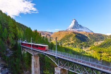 zermatt, switzerland gornergrat red tourist train on the bridge and matterhorn peal panorama in swiss alps