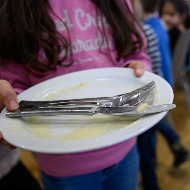 10 december 2019, baden wuerttemberg, stuttgart children take their plates away after lunch in the canteen of a primary school photo sebastian gollnowdpa photo by sebastian gollnowpicture alliance via getty images