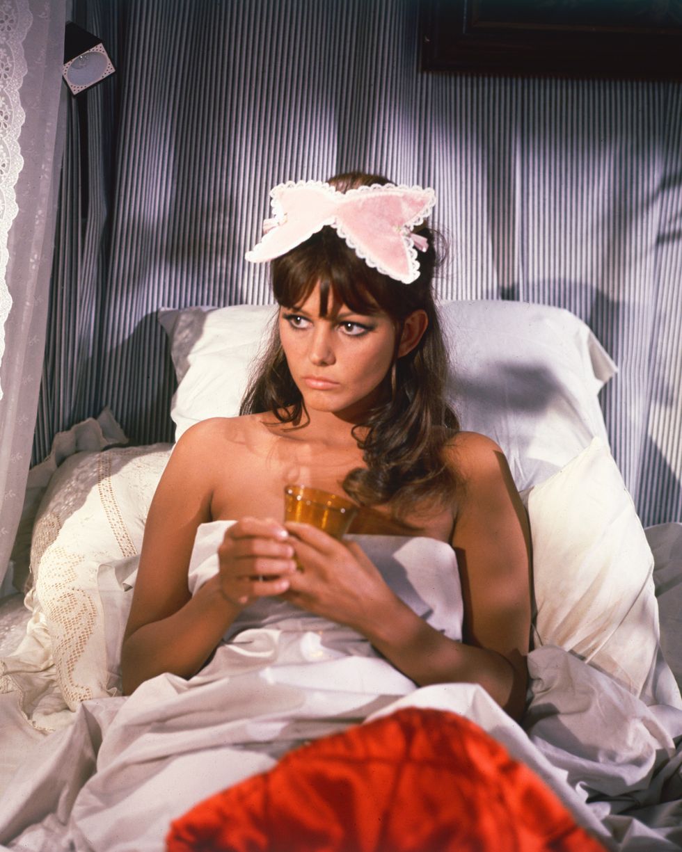 claudia cardinale, italian actress, in bed holding a drink with a sleepmask on her head, circa 1960 photo by silver screen collectiongetty images