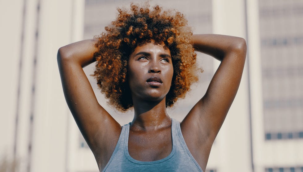 shot of an beautiful young female athlete working out in the city
