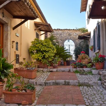 veroli, italy, 12302019 a narrow street between the old houses of a medieval village