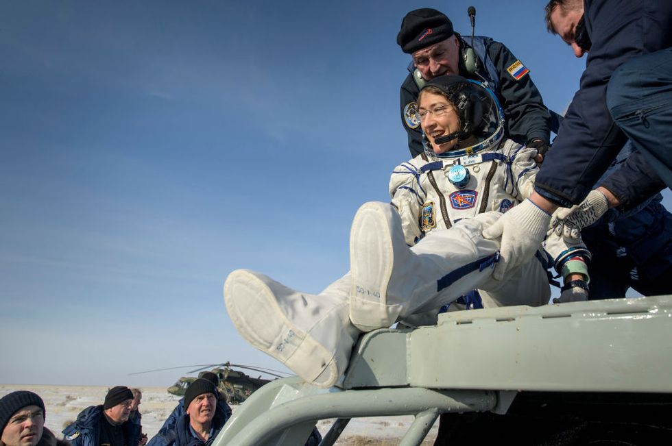 zhezkazgan, kazakhstan february 6 in this handout image supplied by nasa, nasa astronaut christina koch is helped out of the soyuz ms 13 spacecraft just minutes after she, roscosmos cosmonaut alexander skvortsov, and esa astronaut luca parmitano, landed their soyuz ms 13 capsule in a remote area near the town of zhezkazgan, on february 6, 2020 in kazakhstan koch returned to earth after logging 328 days in space the longest spaceflight in history by a woman as a member of expeditions 59 60 61 on the international space station skvortsov and parmitano returned after 201 days in space where they served as expedition 60 61 crew members onboard the station photo by bill ingallsnasa via getty images