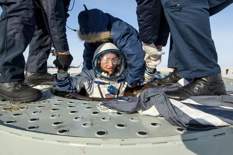 zhezkazgan, kazakhstan february 6 in this handout image supplied by nasa, nasa astronaut christina koch is helped out of the soyuz ms 13 spacecraft just minutes after she, roscosmos cosmonaut alexander skvortsov, and esa astronaut luca parmitano, landed in a remote area near the town of zhezkazgan, on february 6, 2020 in kazakhstan koch returned to earth after logging 328 days in space the longest spaceflight in history by a woman as a member of expeditions 59 60 61 on the international space station skvortsov and parmitano returned after 201 days in space where they served as expedition 60 61 crew members onboard the station photo by bill ingallsnasa via getty images