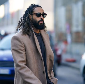 milan, italy   january 11  jerry lorenzo wears sunglasses, a beige long coat, a gray t shirt, outside marni, during milan fashion week fallwinter 20202021, on january 11, 2020 in milan, italy photo by edward berthelotgetty images