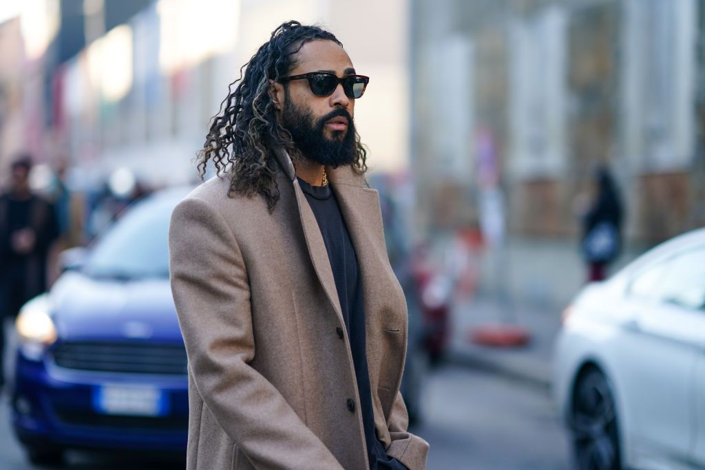 milan, italy   january 11  jerry lorenzo wears sunglasses, a beige long coat, a gray t shirt, outside marni, during milan fashion week fallwinter 20202021, on january 11, 2020 in milan, italy photo by edward berthelotgetty images