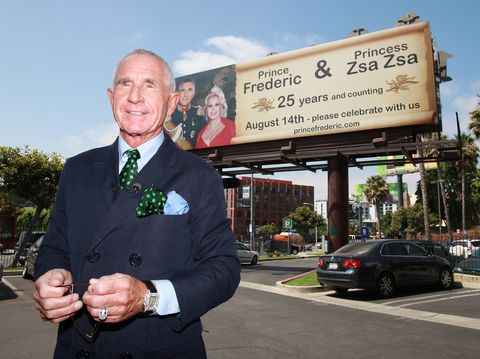 ​Prince Frederic von Anhalt poses at a 44-foot high billboard on Sunset Blvd celebrating 25 years of marriage to Zsa Zsa Gabor on July 27, 2011.