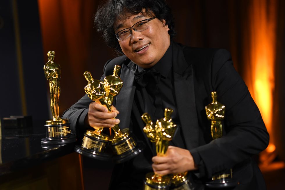 topshot   south korean film director bong joon ho poses with his engraved awards as he attends the 92nd oscars governors ball at the hollywood  highland center in hollywood, california on february 9, 2020 photo by valerie macon  afp photo by valerie maconafp via getty images