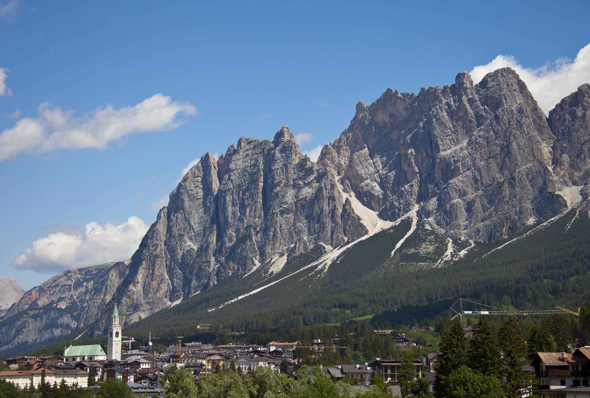 cortina dampezzo, italy   july 04 cityview with the dolomites and the church parrocchiale ss filippo e giacomo on july 04, 2011 in cortina dampezzo, dolomites, italy cortina is famous for skiing in winter and hiking, climbing, mountainbiking in summer  photo by eyeswideopen getty images