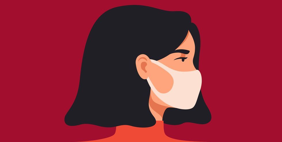 young asian woman wears a breathing mask to protect against coronavirus and air pollution the concept of preventing the spread of viral infectious diseases