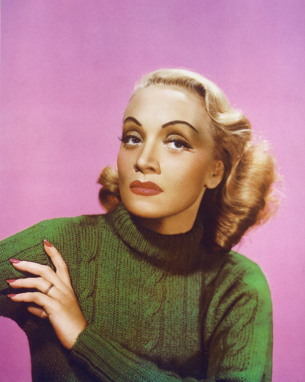 marlene dietrich 1901 1992, german actress and singer, wearing a green polo neck jumper in a studio portrait, against a pink background, circa 1940 photo by silver screen collectiongetty images