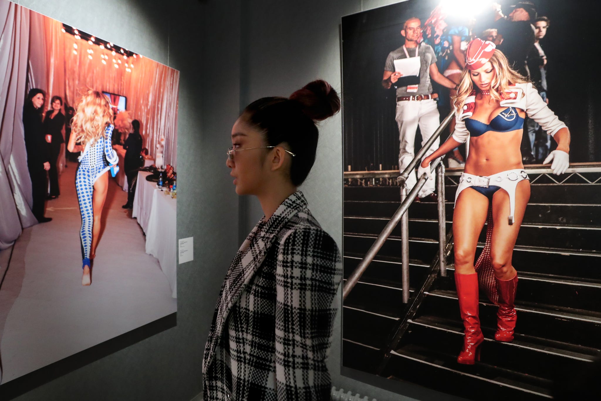 st petersburg, russia   february 27, 2020 a woman attends an exhibition of works by australian photographer russell james titled a decade backstage at victorias secret fashion show at the erarta museum of contemporary art alexander demianchuktass photo by alexander demianchuk\tass via getty images