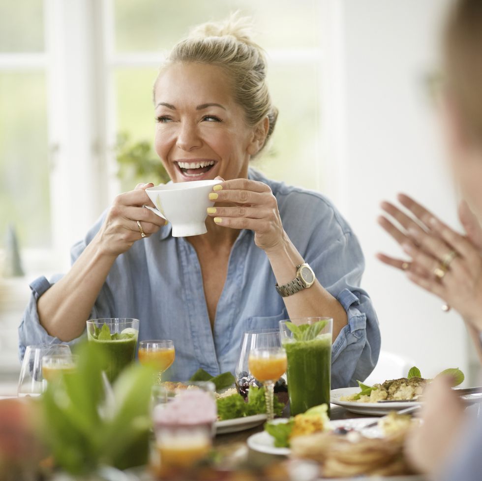 happy woman at table