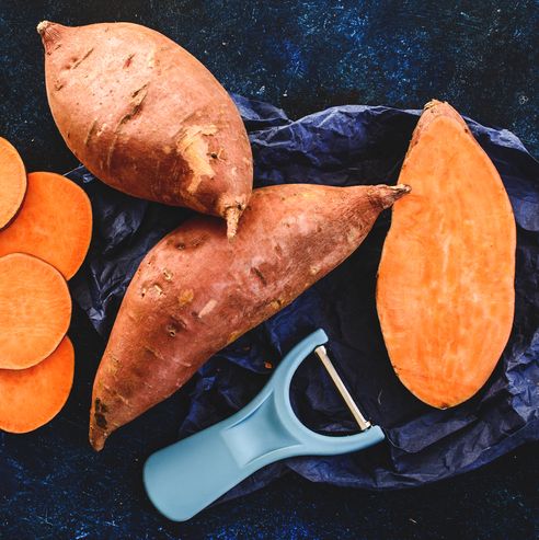 sliced and whole sweet potatoes