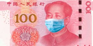China quarantine, 100 yuan banknote with medical mask. The concept of epidemic and protection against coronavrius.