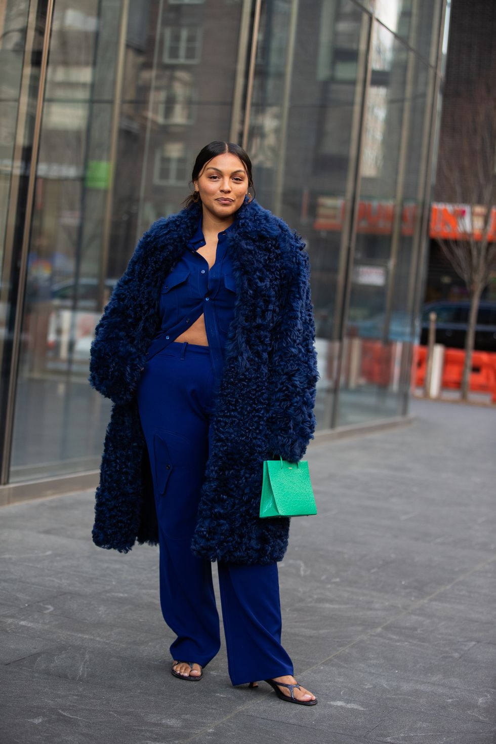 paloma elsesser in a texture fur blue coat shirt and pants