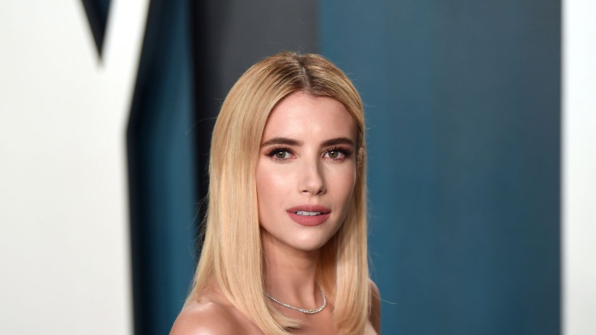 Emma Roberts uses a gold toothbrush to perfect her brows