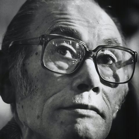 fred korematsu looks to the left and wears large eyeglasses
