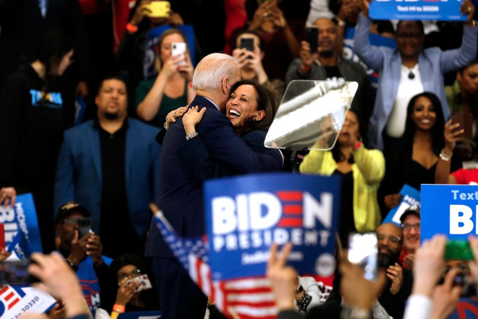 Kamala Harris hugs Joe Biden after she endorsed him at a campaign rally at Renaissance High School in Detroit, Michigan on March 9, 2020
