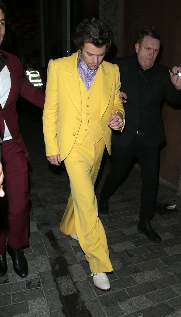 harry styles wearing a yellow suit