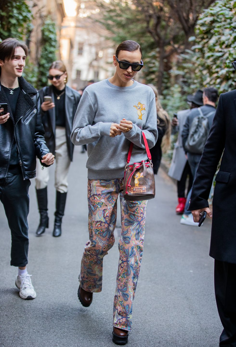 milan, italy   february 21 irina shayk is seen wearing grey jumper, pants with print bucket bag outside etro during milan fashion week fallwinter 2020 2021 on february 21, 2020 in milan, italy photo by christian vieriggetty images