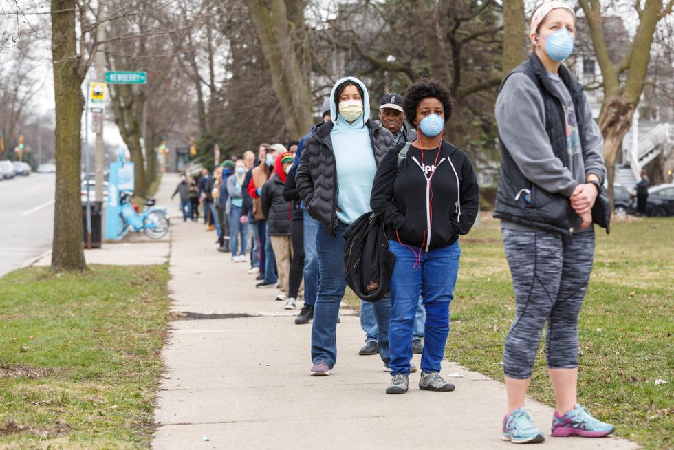 milwaukee, wi  april 7 a line to vote in wisconsins spring primary election wraps around for blocks and blocks on tuesday, april 7, 2020 at riverside high school in milwaukee, wi photo by sara stathas for the washington post