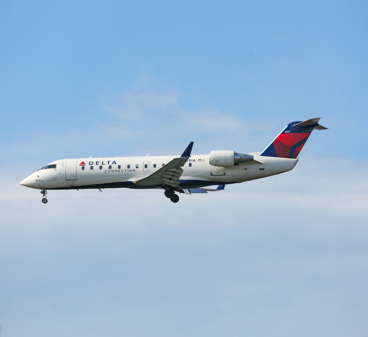 delta air lines bombardier crj 200 aircraft as seen on final approach landing at new york jfk international airport, ny, usa the flight is operated by endeavor air, an american regional airline that operates as delta connection the airplane has the registration n8891a dal dl delta airlines is a major legacy carrier, member of skyteam aviation alliance with headquarters in atlanta, georgia photo by nicolas economounurphoto via getty images