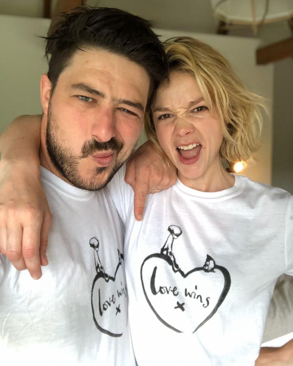london, england april 20 marcus mumford and carey mulligan, wearing a limited edition t shirt created in collaboration with charlie mackesy featuring his beloved characters, the boy and the mole alongside the poignant slogan, love wins, on april 20, 2020 in london, england the t shirt goes on sale for £15 and is available online at comicreliefcomlove wins, with every pound going to charities on the front line of the coronavirus fight photo by marcus mumford and carey mulligan comic relief via getty images
