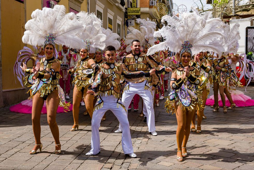 santa cruz de tenerife, tenerife island, spain   20200229 a group of dancers in colorful dresses and smiling, dancing in the streets during the daytime carnival photo by frank bienewaldlightrocket via getty images