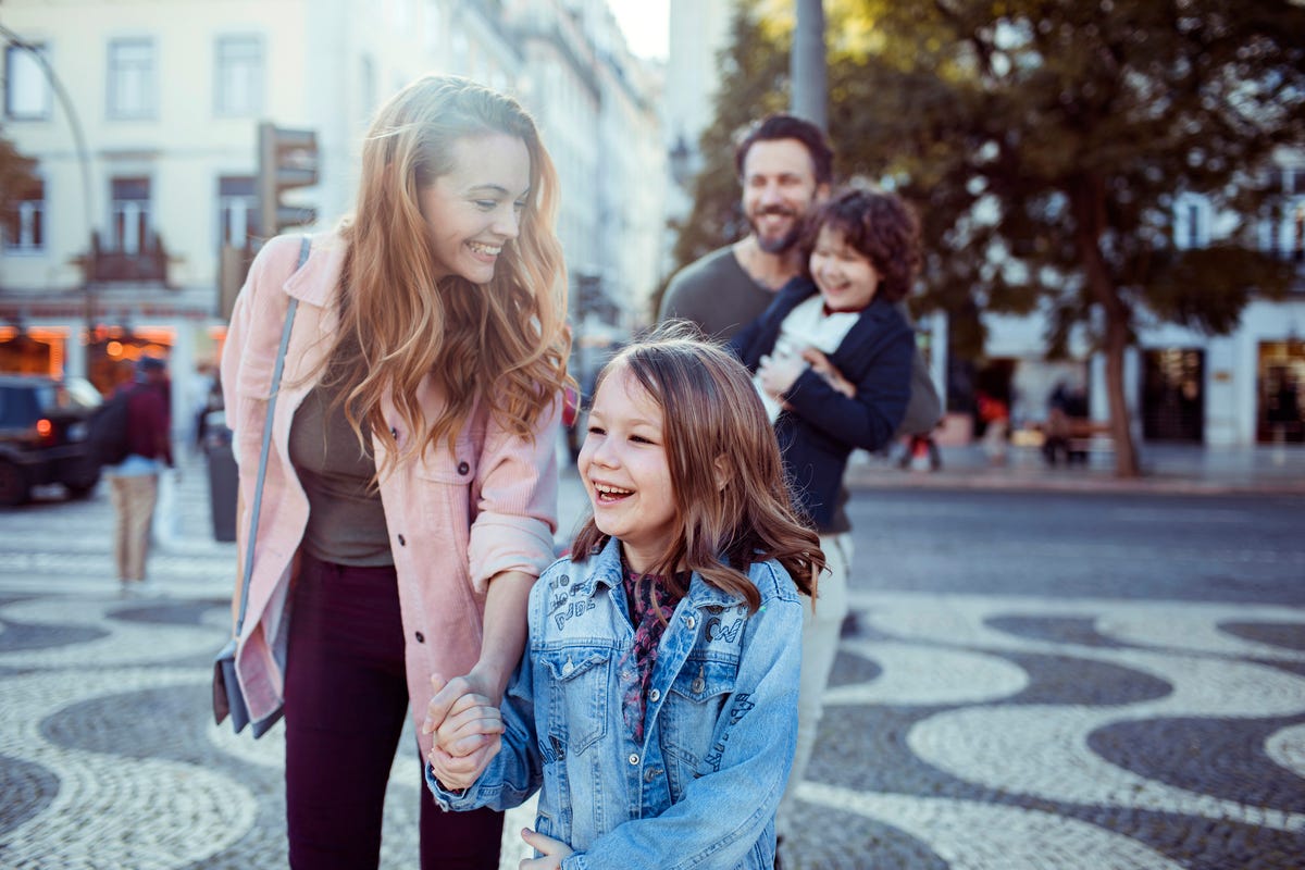 close up of a young happy family exploring the rossio square