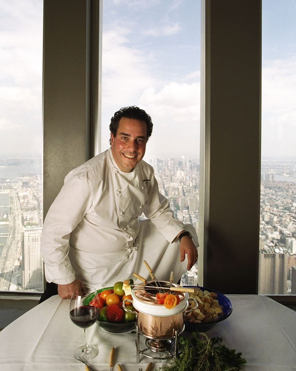 windows on the worlds executive chef michael lomonaco with a dish of cheese fonduephoto by james keivomny daily news via getty images