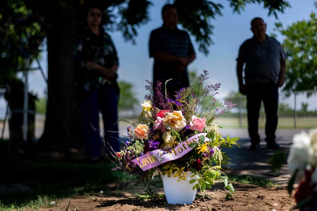 on good friday hortensia sosa died from covid 19 while at redwood springs health center's nursing home in visalia, her family olivia sosa lopez, richard sosa, and richard lopez, stand at her grave mourning the death and scorning the nursing home's poor care at smith mountain cemetery in dinuba, california sunday may 3, 2020
