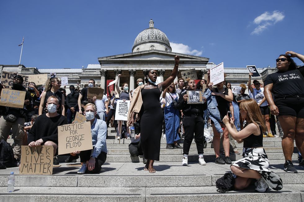 london, england   may 31 people hold placards as they join a spontaneous black lives matter march at trafalgar square to protest the death of george floyd in minneapolis and in support of the demonstrations in north america on may 31, 2020 in london, england the death of an african american man, george floyd, at the hands of police in minneapolis has sparked violent protests across the usa a video of the incident, taken by a bystander and posted on social media, showed floyds neck being pinned to the ground by police officer, derek chauvin, as he repeatedly said i can’t breathe chauvin was fired along with three other officers and has been charged with third degree murder and manslaughter photo by hollie adamsgetty images