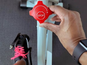 close up of unrecognizable black woman turning resistance knob on exercise bike