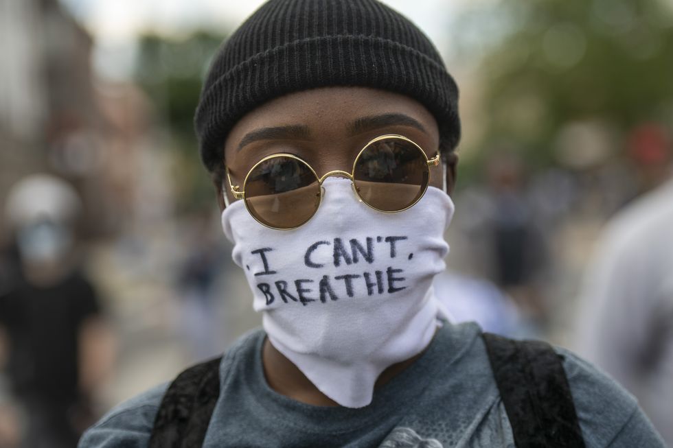 philadelphia, pa   june 01 a protester marches with a cloth mask stating i cant breathe in the aftermath of widespread unrest following the death of george floyd on june 1, 2020 in philadelphia, pennsylvania demonstrations have erupted all across the country in response floyds death in minneapolis, minnesota while in police custody a week ago photo by mark makelagetty images