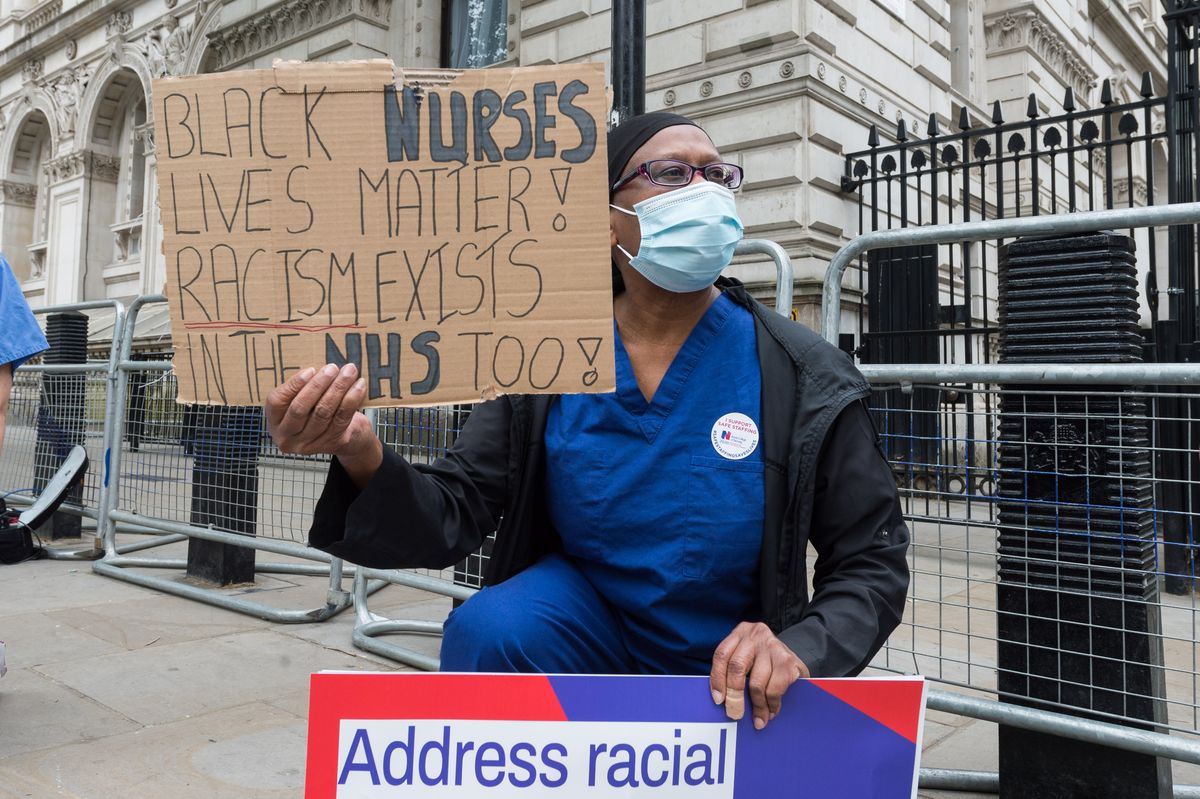 london, united kingdom   june 03, 2020 a group of nurses wearing face masks protest outside downing street demanding a pay rise, effective protection against covid 19 and highlighting a disproportionately higher mortality rate from the novel coronavirus among bame ethnic minority groups on 03 june, 2020 in london, england  photograph by wiktor szymanowicz  barcroft studios  future publishing photo credit should read wiktor szymanowiczbarcroft media via getty images