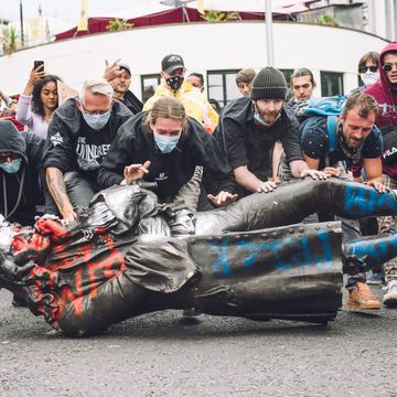 protesters transporting the statue of colston towards the river avon edward colston was a slave trader of the late 17th century who played a major role in the development of the city of bristol, england, on june 7, 2020 photo by giulia spadaforanurphoto via getty images