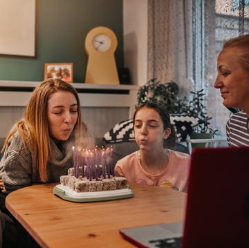 Teenage Girl Celebrating Her 18th Birthday With Family In Isolation And Chatting With Friends Online birthday wishes for daughter
