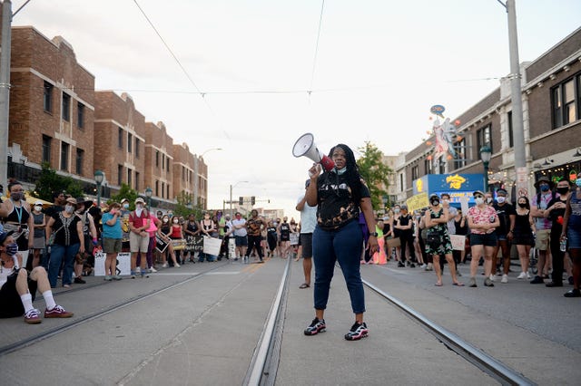 university city, mo   june 12 missouri democratic congressional candidate cori bush leads protesters as they take to the street to protest against police brutality on june 12, 2020 in university city, missouri protest continue across the world since george floyd died in minneapolis police custody on may 25 photo by michael b thomasgetty images