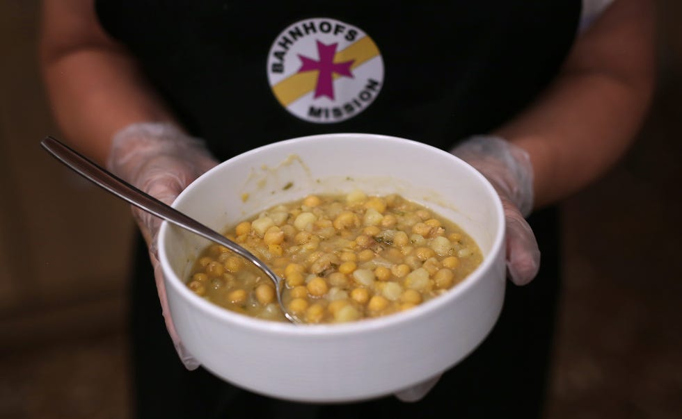 03 june 2020, saxony anhalt, magdeburg stefanie pannor serves a plate of pea soup at the ecumenical station mission in magdeburg central station in the current corona crisis the amount of donations is particularly high to dpa "station missions in the country experience a lot of attention in corona times" photo ronny hartmanndpa photo by ronny hartmannpicture alliance via getty images