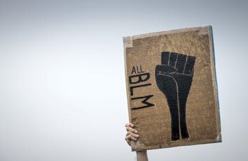 topshot   a protester holds up a placard reading all blm short for black lives matter during a demonstration in deventer, the netherlands, on june 14, 2020 as part of the worldwide protests against racism and police brutality photo by robin van lonkhuijsen  anp  afp  netherlands out photo by robin van lonkhuijsenanpafp via getty images